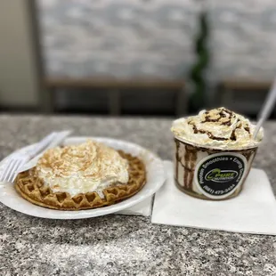 a cup of ice cream and a waffle