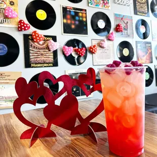 a drink and a record on a table