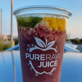 a smoothie in a plastic cup