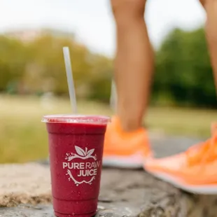 a woman standing on a stone ledge