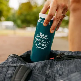 a person holding a water bottle
