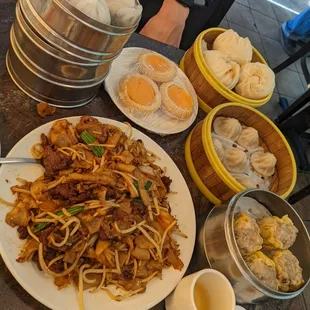 Dry beef chow fun, pork buns, shrimp hagow, pork and shrimp siu mai, egg custard and green tea of course