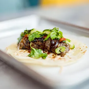 a taco on a plate on a table