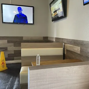 Inside seating along with a bunch of tv