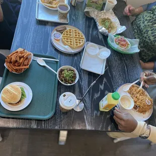 Tikki Burger w/Sweet Potato Fries, Deconstructed Samosa, Channa Masala, Jackfruit Biryani, Plain waffle, Mushroom Sukka, Sambar Idily