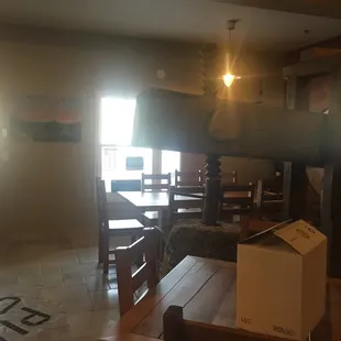 a table and chairs in a dimly lit room