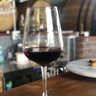 a glass of wine and a plate of food