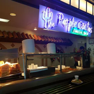 a restaurant counter with food on it