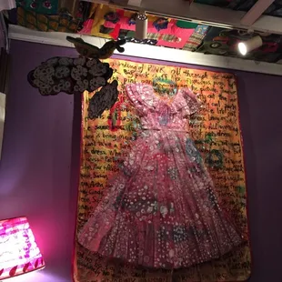 a painting of a woman in a pink dress