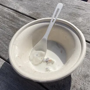 a spoon in a bowl of ice cream