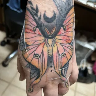 Fresh lunar moth tattoo