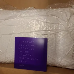 Pillow and brochure with details of material inside