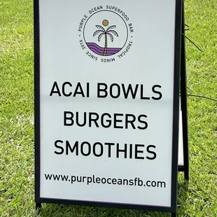 a sign for acai bowls burgers smoothies