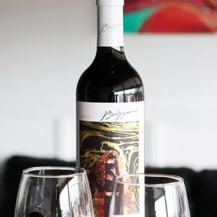 a bottle of wine and two wine glasses