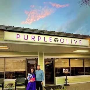 a couple standing outside