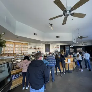 a crowd of people standing in line