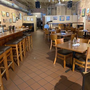 a restaurant with tables and chairs