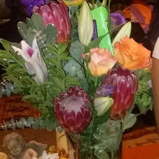 She ended up getting this drab, grouping of flowers. Dull, no life, no creativity, thrown together for $110.00. My poor cousin!