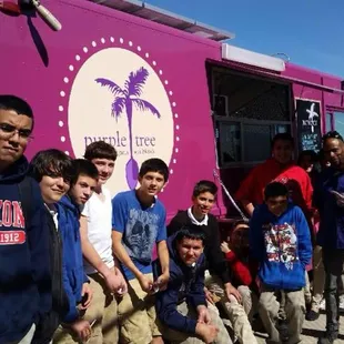a group of young boys posing for a picture