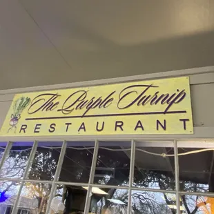 the sign above the restaurant