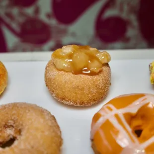 The JIMBO. A cinnamon sugar rolled donut with Apple Pie Filling and a Caramel Drizzle. Always made to order!