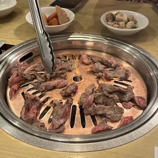 meat being cooked in a hot pot