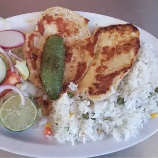 a plate of rice and vegetables