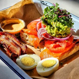 Perfect Brunch: open faced salmon sandwich, with crushed avocado, egg, bacon, chipotle mayo...yummy!