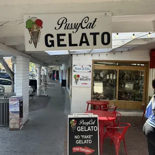 a woman walking down the sidewalk