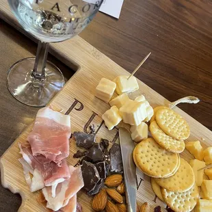 Sample size glass and yummy meat/cheese option. Prosciutto, Gouda, havarti and Brie