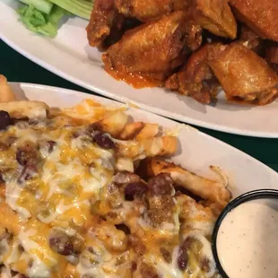 Chili cheese fries and hot garlic wings