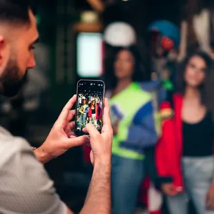 a man taking a picture of a group of people