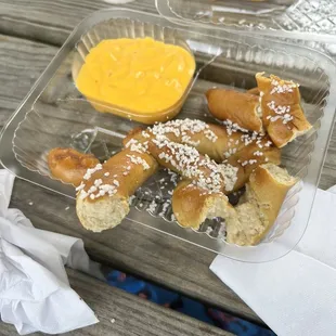 A pretzel with cheese (torn apart for my toddler)
