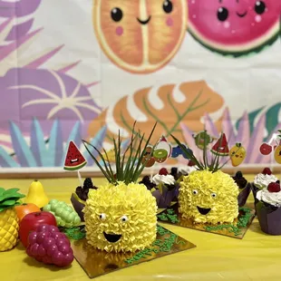 The custom made pineapple smash cakes with chocolate and vanilla cupcakes.