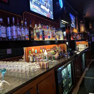 a bar with many bottles of alcohol