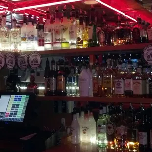 a bar filled with alcohol bottles