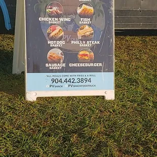 a sign in front of a truck