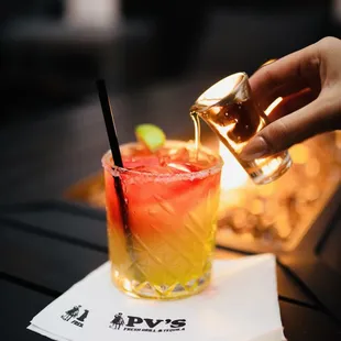  person pouring a drink