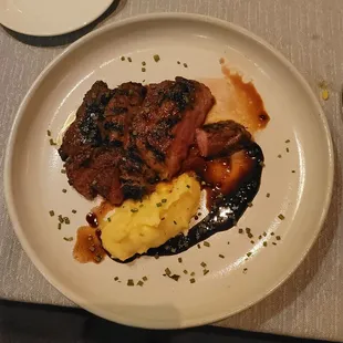 14 oz Prime ribeye with whipped Yukon Gold potatoes.