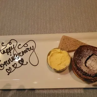 Chocolate souffle with sweetened mascarpone and a stone ground cornmeal shortbread cookie.