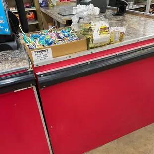 a grocery store with a counter and shelves