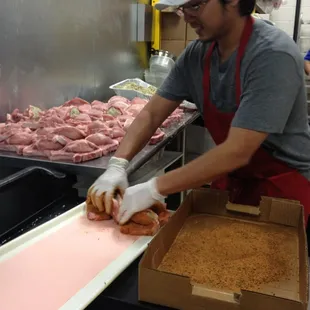 a man preparing food in a kitchen