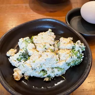 a bowl of tofu and an egg
