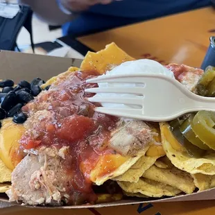 a plate of nachos and chips