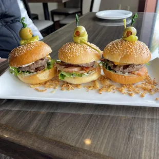 three sliders on a plate