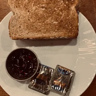 a toasted piece of bread with jam on a plate
