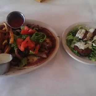 Kabob sandwich with fries ($11) and a side of falafel ($3).
