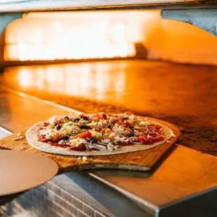 a pizza cooking in an oven