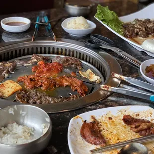 Grillin&apos; and chillin&apos;! Spicy pork bulgogi, beef bulgogi, and I also throw some of the kimchi on the grill to add even more *flavor*