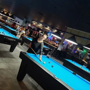 a woman playing pool